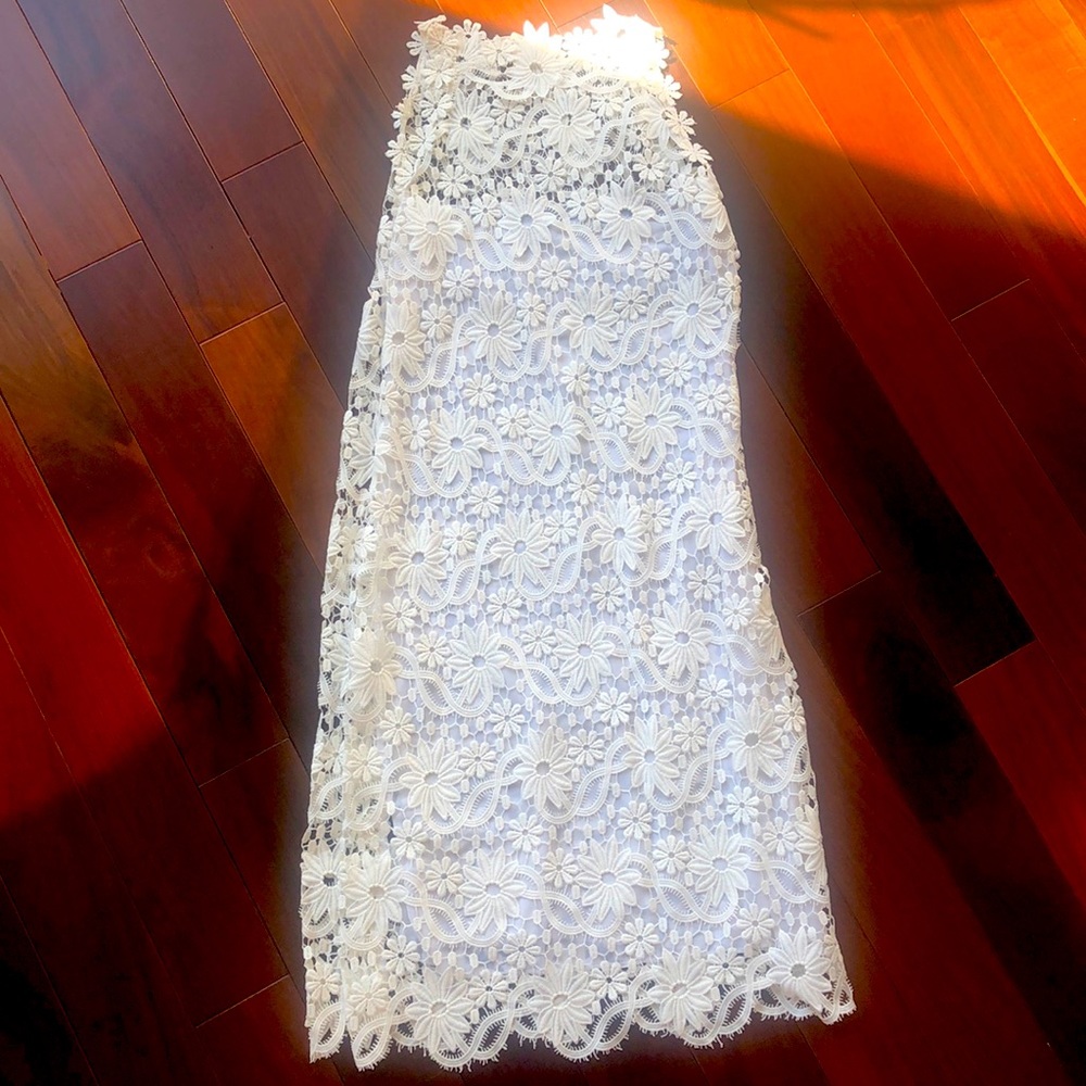 White lace-like dress with flowers, from Ibimoda, Ibiza